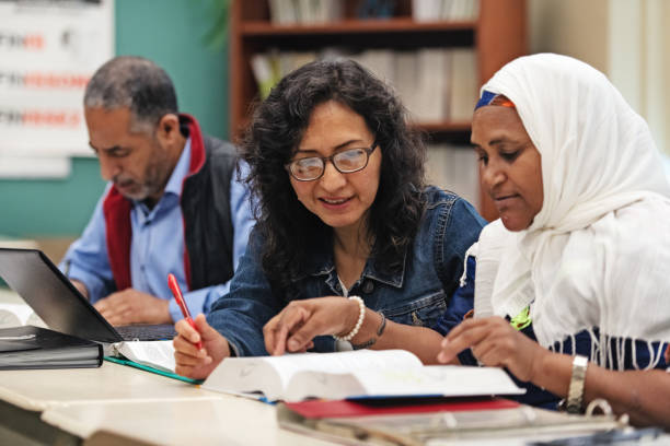 Multi-ethnic adults education classroom stock photo
