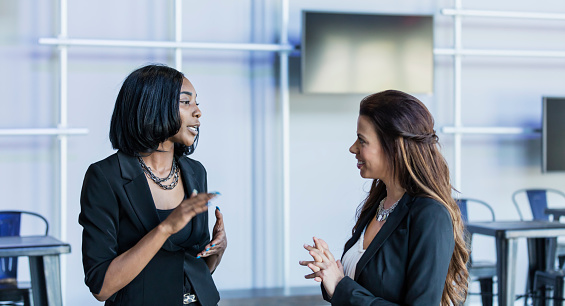 Multi-ethnic businesswomen talking
