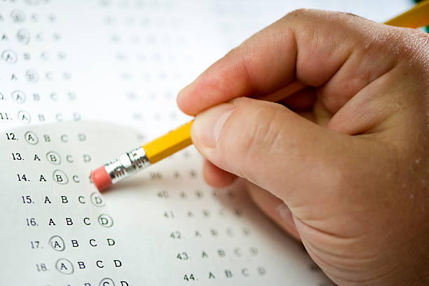 Multiple Choice Someone erasing an answer on a multiple choice test. mephedrone stock pictures, royalty-free photos & images