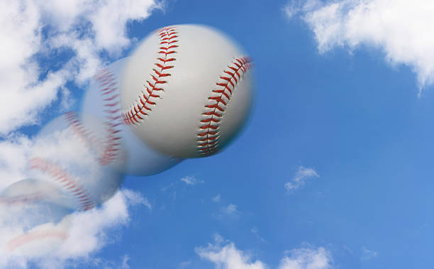 esposizione multipla di baseball volare attraverso il cielo - sphere flying foto e immagini stock