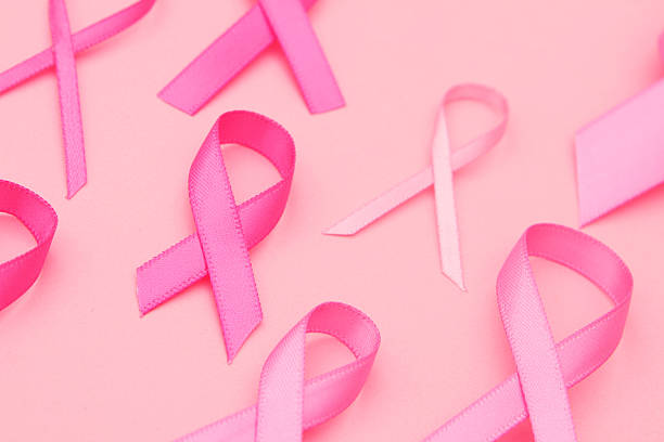 Multiple pink awareness ribbons for breast cancer awareness stock photo