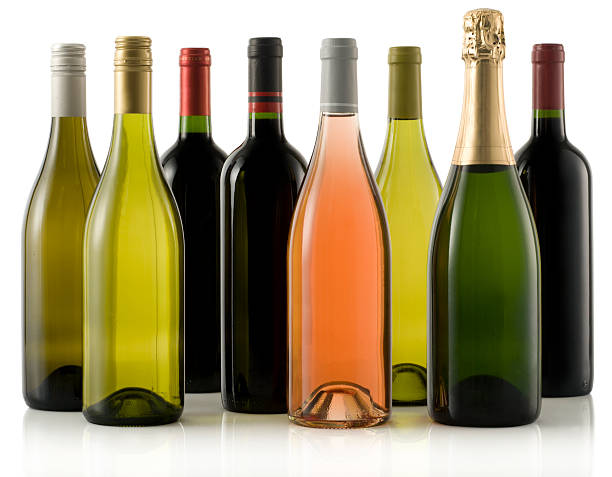 Multiple wine and champagne bottles stock photo