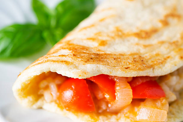 Mung Bean Eggless Pancake Stuffed with Rice Tomato and Onion Mung Bean Eggless Gluten-Free Pancake Stuffed with Rice Tomato and Onion (shallow depth of field) thosai stock pictures, royalty-free photos & images