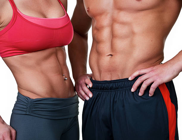 Muscular man and woman stock photo