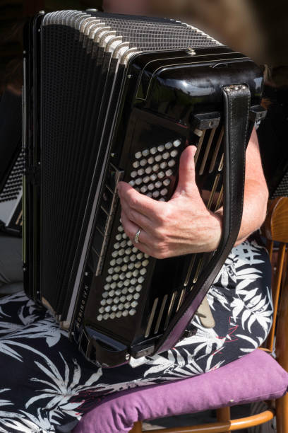 music concert with a woman playing the accordion instrument stock photo