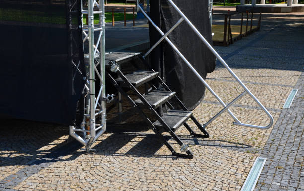 music stage built of aluminum beams. the folding design with a black tarpaulin will enable musical, theatrical, cultural performances in any weather. the straps stabilize in the wind - ropes backstage theater imagens e fotografias de stock