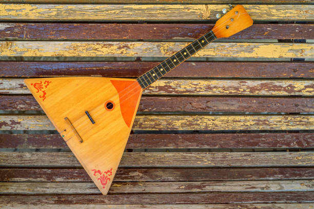 Musical instrument balalaika on wooden background stock photo