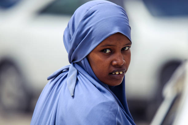 Muslim Woman in Hijab walking on the Capital Streets stock photo