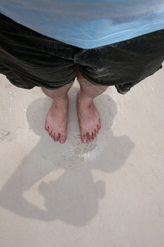 My foot on the beach at Koh Lan Island, Pattaya, Chonburi, Thailand
