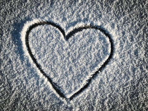 Heart drawing in fresh snow for valantines day