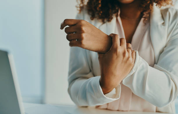 My wrist needs a bit of rest Shot of an unrecognisable businesswoman experiencing wrist pain while working in a modern office bone fracture stock pictures, royalty-free photos & images