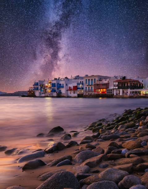 Mykonos, Greece. View of a traditional house in Mykonos. The area of Little Venice. Milky way. Sea shore and beach. Photo for travel and vacation. stock photo