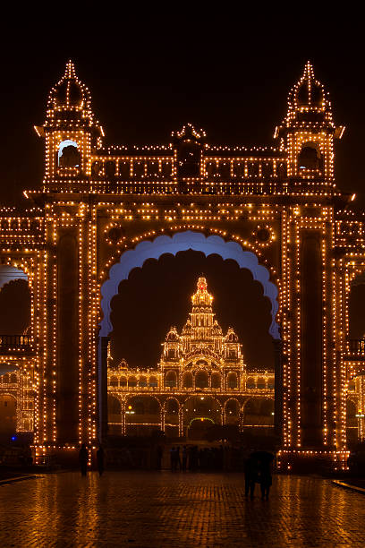 Mysore Palace or the Mysore Maharaja Palace at night Mysore, India - October 9, 2011: Mysore Palace or the Mysore Maharaja Palace is located in the heart of the city. Mysore Palace is the second most visited monuments in India he lost only to Taj Mahal. Mysore Palace is priceless national treasure and the pride of a kingdom, the Mysore Maharaja Palace is the seat of the famed Wodeyar Maharaja's of Mysore. The palace is now converted into a museum that treasures souvenirs, paintings, jewelery, royal costumes and other items, which were once possessed by the Wodeyars. mysore stock pictures, royalty-free photos & images