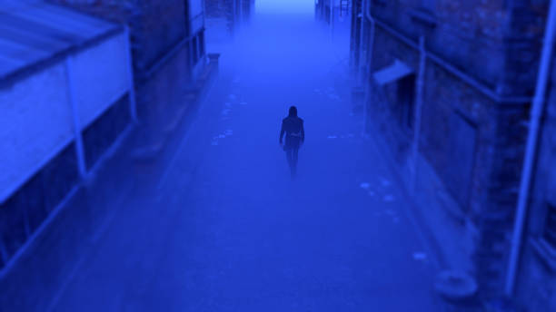 Mysterious man in a hoodie walks in a misty abandoned urban alley at dusk. High angle view. 3D render. stock photo