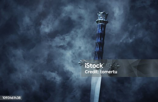 istock mysteriousand magical photo of silver sword over gothic snowy black background. Medieval period concept. 1093461438