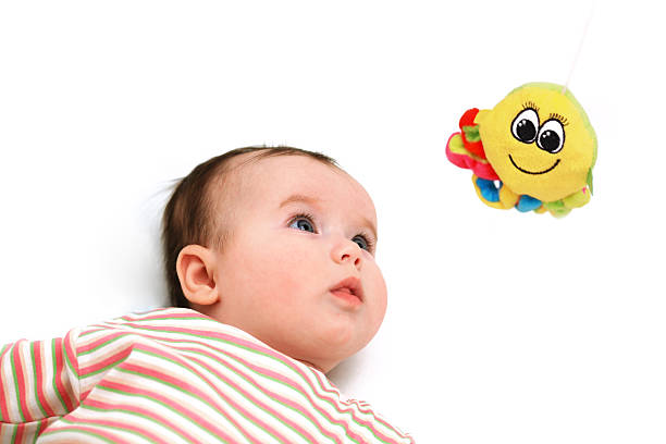 Nace baby keep an eye on the octopus toy stock photo