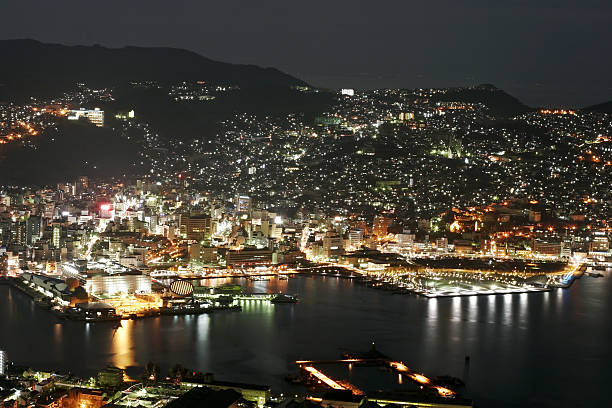 Nagasaki at Night A night view of Nagasaki's waterfront. nagasaki prefecture stock pictures, royalty-free photos & images