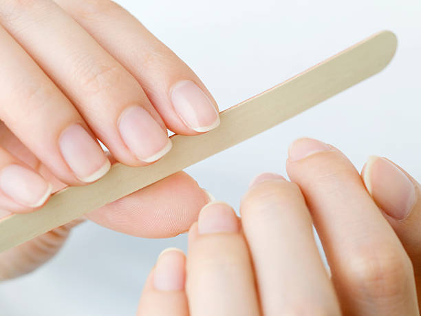 Nail care for women Nail care for women nail file stock pictures, royalty-free photos & images