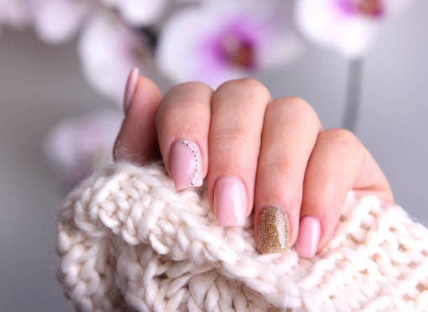 Nail design soft colors. Nail design soft pink color.Winter manicure. artificial nail stock pictures, royalty-free photos & images