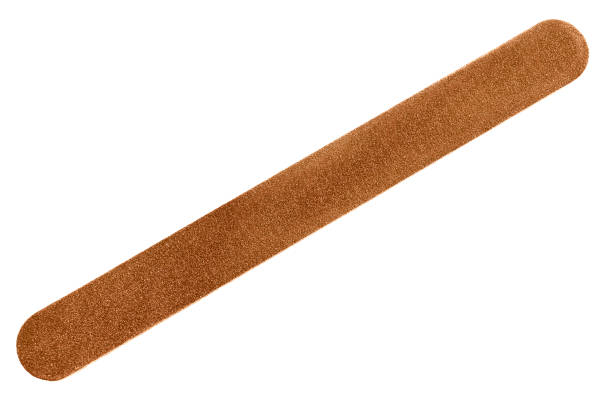 Nail file isolated Brown long nail file on white background nail file stock pictures, royalty-free photos & images