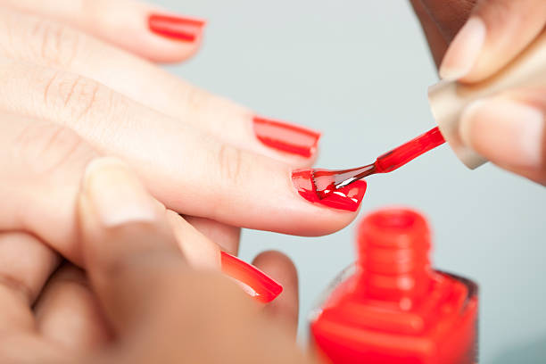 nail polish. - nail polish bottle close up stockfoto's en -beelden