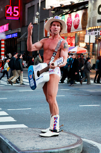 Naked Cowboy Showing Muscles On Times Square New York 