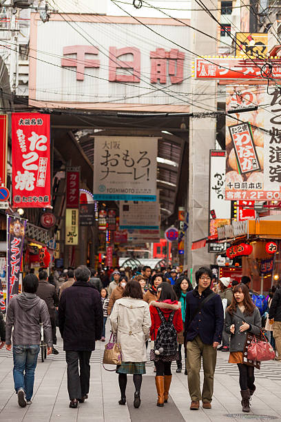 Namba entertainment district, Osaka, Japan "Osaka, Japan - March 19, 2012: Namba entertainment district. Many people can be seen in the pedestrian zone outside shops and restaurants and entering or exiting the arcade." mcdonalds japan stock pictures, royalty-free photos & images