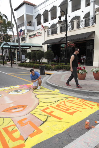 Naples Chalk art on 5th Ave South. Naples, Fl, USA - January 27, 2017: Naples Chalk art on 5th Ave South. Chalk art when professionals, students, organizations and family artists take over 5th Ave South with fabulous chalk art drawings. fair faced concrete stock pictures, royalty-free photos & images