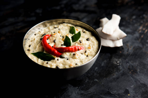 Nariyal or Coconut Chutney served in a bowl. Isolated over moody background. selective focus Nariyal or Coconut Chutney served in a bowl. Isolated over moody background. selective focus chutney stock pictures, royalty-free photos & images