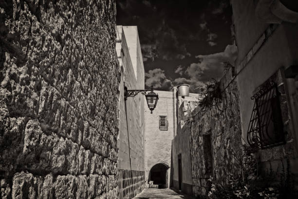 A narrow alley in Malta in Black and White stock photo