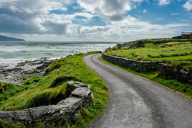 Narrow Coastal Road in Ireland Narrow Coastal Road in Ireland wild atlantic way stock pictures, royalty-free photos & images