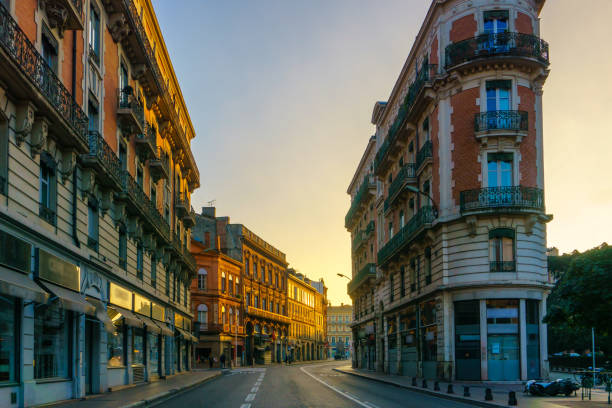 Narrow historic street with old buildings in Toulouse, France stock photo