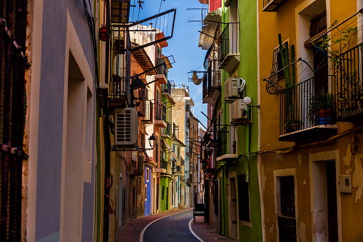 Narrow street in the historic center of the town of Villajoyosa, june 2021, Villajoyosa, Alicante, Spain.