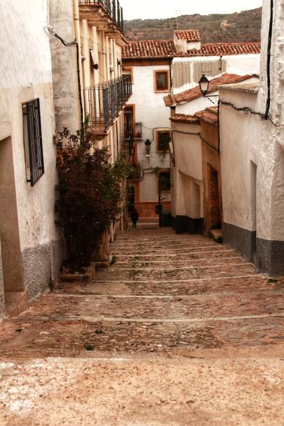 Narrow streets and old facades Narrow streets and old facades in Alcaraz, Castilla la Mancha community, Spain alcaraz stock pictures, royalty-free photos & images