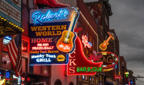 Nashville Broadway Strip Nashville, Tennessee - October 8, 2017: Neon signs light the strip along Broadway in Nashville broadway nashville stock pictures, royalty-free photos & images