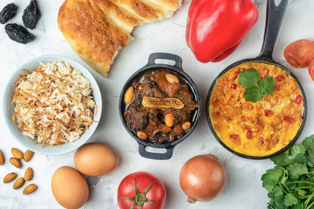 National cuisine of Turkey. Flatlay. Turkish omelet, Menemen, Kuzu mutancana and pilaf. There are a lot of ingredients around. stock photo
