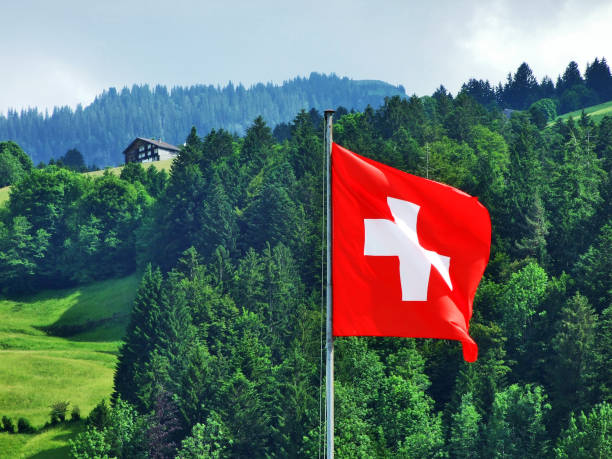 National flag of the Swiss Confederation (Flag of Switzerland - National Flag of Switzerland) / Nationalflagge der Schweizerischen Eidgenossenschaft (Offizielle Flagge der Schweiz - Schweizer Flagge) stock photo