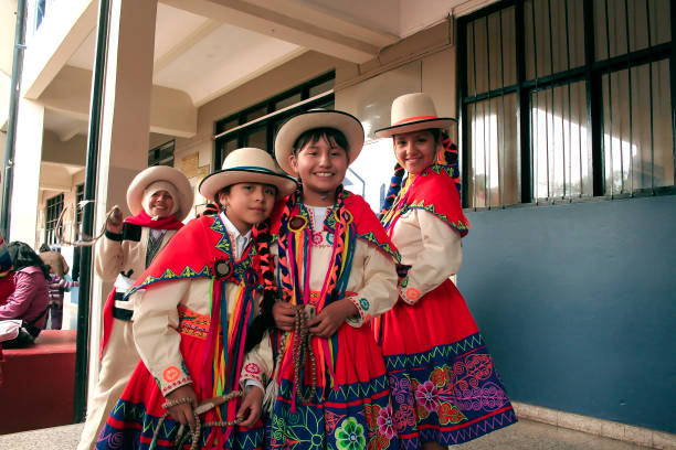 Native Peruvian group of young girls before "Wayna Raimi" traditional dance Cusco, Peru - Circa June 2013: Native Peruvian group of young girls before "Wayna Raimi" traditional dance with colorful typical clothing in preparation of the "Inti Raymi" festival. peru girl stock pictures, royalty-free photos & images