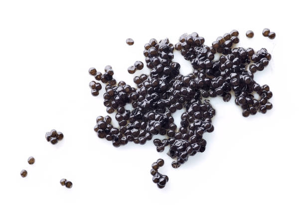 natural black caviar isolated on white background natural black caviar isolated on white background, top view roe stock pictures, royalty-free photos & images