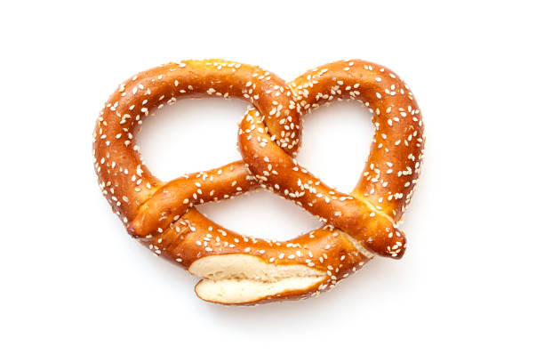 Natural handmade pretzel isolated on white. Traditional Bavarian pretzel for Oktoberfest and as snack for beer, top view stock photo