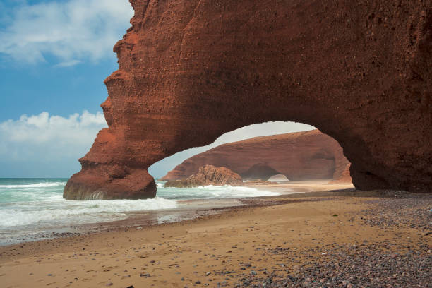 Natural stone arches on Atlantic shore. Legzira, Morocco stock photo