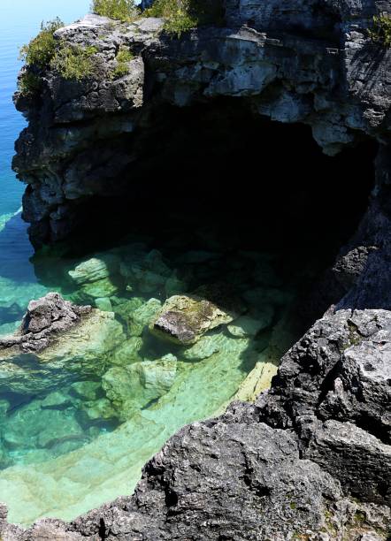 Natural wonder of one of the most popular Canadian national parks Grotto a natural sea cave near Tobermory Ontario popular for scuba divers and snorkelling bruce peninsula stock pictures, royalty-free photos & images