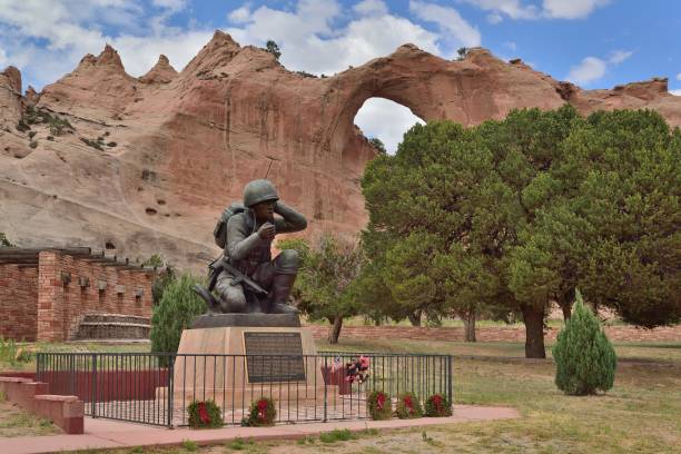 Navajo Code Talkers Memorial - II The memorial to the Navajo Code Talkers from world war II is in the back in the window rock, AZ city park with the Window Rock formation in the background navajo culture stock pictures, royalty-free photos & images