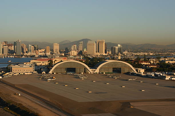 Naval Air Station North Island Hangars These two hangars are historical landmarks in San Diego. The were built in World War Two for seaplanes. San Diego is in the background.  military base stock pictures, royalty-free photos & images