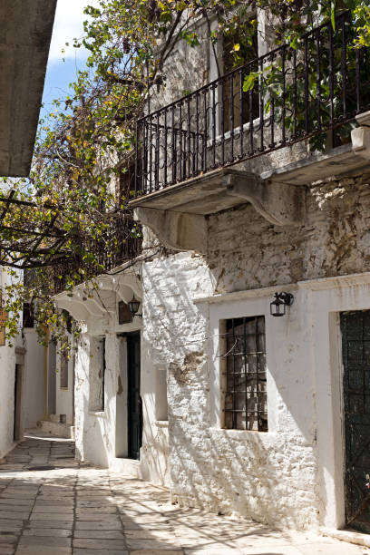Naxos - Apeiranthos houses, paved street with white marble - Cyclades, Greece stock photo
