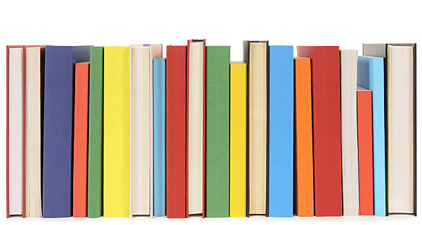 Neat row of colorful paperback books stock photo