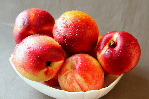 Nectarines with drops of water. stock photo