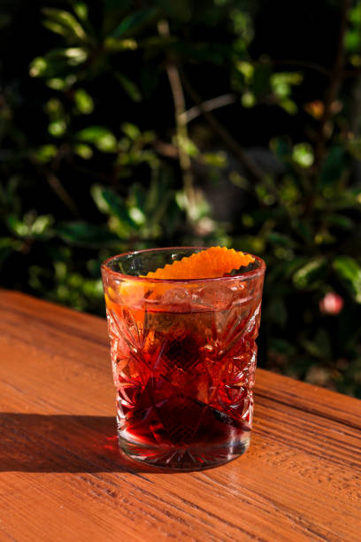 Negroni cocktail aperitif with orange zest stock photo