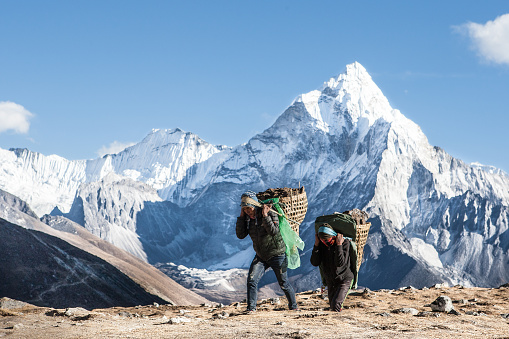 Nepalese sherpa working at Everest area, Sagarmatha national park,  Nepal, December 2018