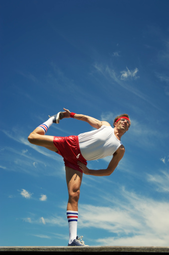 Nerd Athlete Stretches Against Blue Sky Stock Photo - Download Image ...